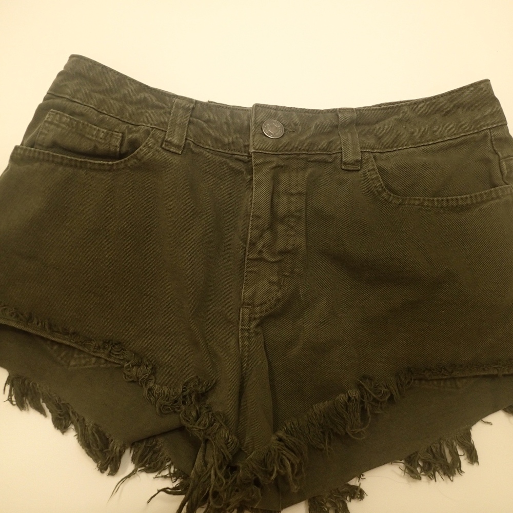 Green high waisted jean shorts with fringe